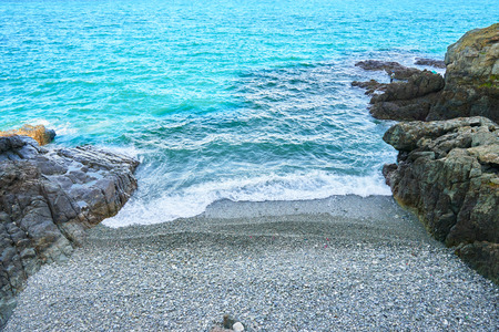 Blue sea and narrow pebble beach in Busan, Korea.の写真素材
