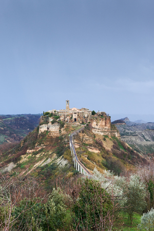 Civita di Bagnoregio, it is a small town in the Province of Viterbo in Italy. The town is famous for its position atop a plateau of friable volcanic tuff overlooking the Tiber river vally.のeditorial素材
