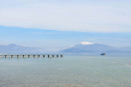 Landscape of Lake Garda, view from Sirmione peninsula which divides the lower part of Lake Garda. It is a famous vacation place for a long time in northern Italy.の写真素材