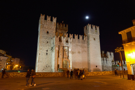 Sirmione, Italy - February 21, 2016: The Scaliger Castle is a medieval port fortification located at the entrance to the sirmio peninsula which divides the lower part of Lake Garda.のeditorial素材