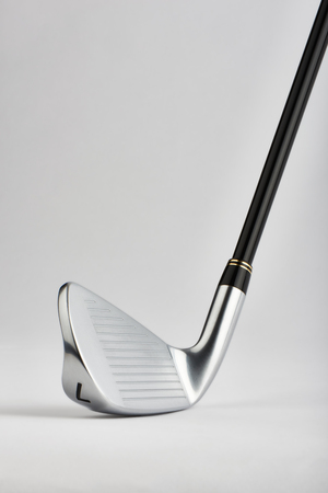 Close-up of Golf club iron no.7 head on a white backgroundの写真素材