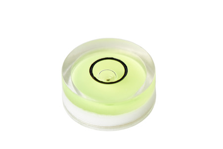 Closeup of round shape bubble level measuring tool, isolated on white.