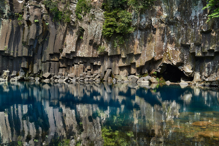 Cheonjeyeon 1st waterfall. Cheonjeyeon is a three-tier waterfall, which is one of the most famous falls in Jeju island, Korea. At the first waterfall, water falls only when it rains.の写真素材