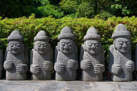 Dol Hareubang, local traditional large rock statues. They are considered to be gods offering protection and fertility and were placed outside of gates for protection against demons.の写真素材