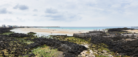 Jeju, Korea - May 23, 2017: Sehwa beach and spring water spot surrounded with basalt stone wall  in Gujwa-eup. it is a small beach becoming famous for serene and calm scenery in recent years.のeditorial素材