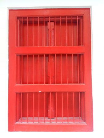 Red window with white wellの写真素材