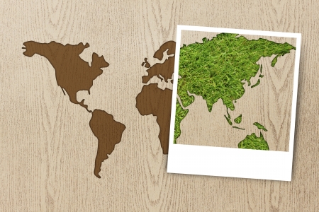 eco concept   frame photo eco world map on wood textureの写真素材