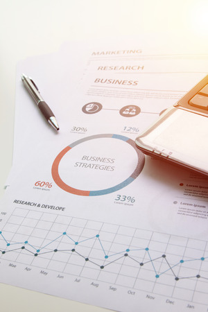 Modern white office desk white table with smartphone and computer and other supplies with Business report meeting and briefing.の写真素材