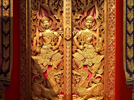 Golden door guards temple in Thailand    の写真素材