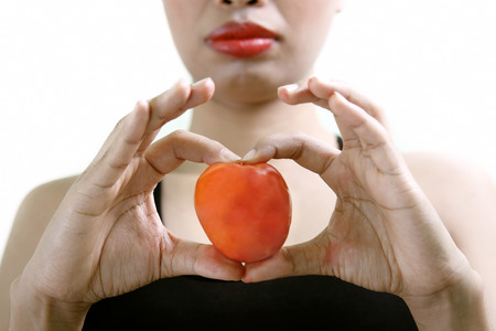 Woman with tomatoesの写真素材