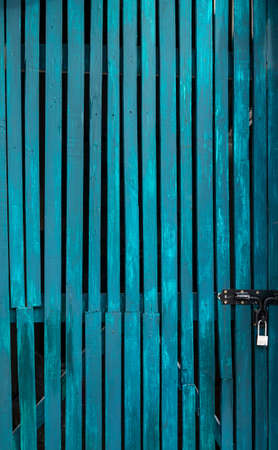 Blue wooden locked door 