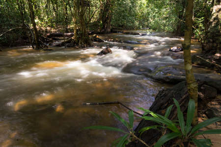 Kbal Spean waterfall flowing on many historic carving rocks situated under the waterの写真素材