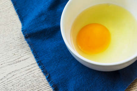 Food ingredient preparation,egg in a bowl の写真素材