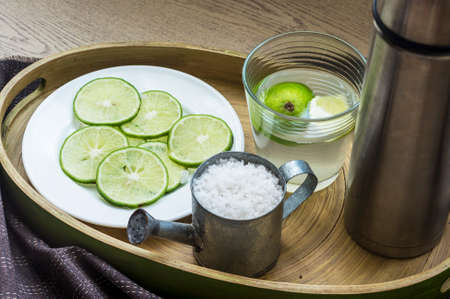 Traditional sore throat therapy - salt,lemon,warm water and lemonade 