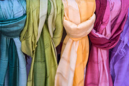 Thai silk and cotton scarves in various colorsの写真素材