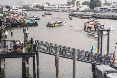 BANGKOK,THAILAND-APRIL 12,2015: Traveling by boats is quite popular along Chao Praya River during Thai New Year Festival .のeditorial素材