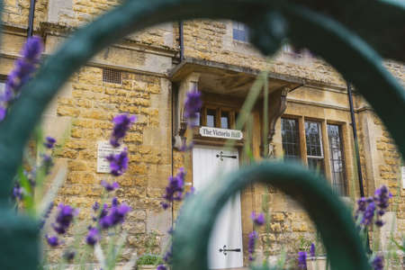 GLOUCESTERSHIRE,ENGLAND-AUGUST 5,2016 : close up of Victoria Hall through lavender blooming in summer time.のeditorial素材