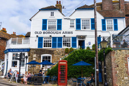 EAST SUSSEX,ENGLAND-AUGUST 3,2016 : View of historic town , Rye, and old beautiful shops and buildings on Mermaid Street. The town is crowded during summer time.のeditorial素材