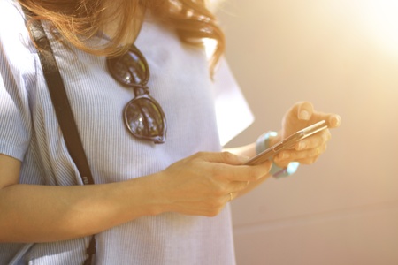 Women using mobile technologyの素材