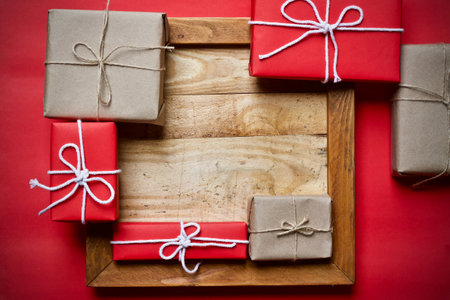 Christmas gift boxes on wooden background. Top view with copy space.