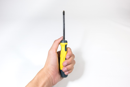 Man Hand holding screwdriver on white background - fix Conceptの写真素材
