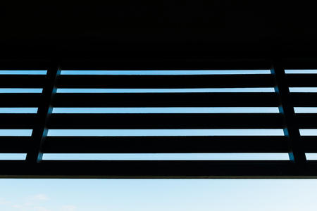 silhouette wooden slat with blue skyの写真素材