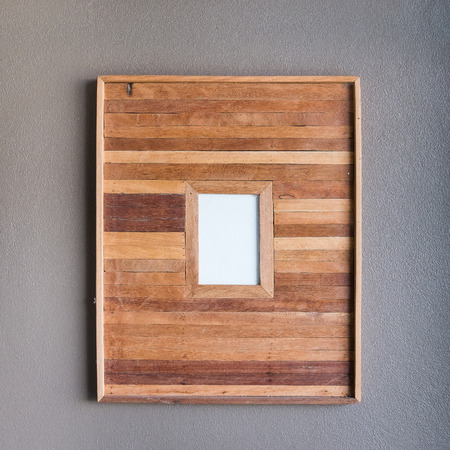 wooden frame on a concrete wallの写真素材