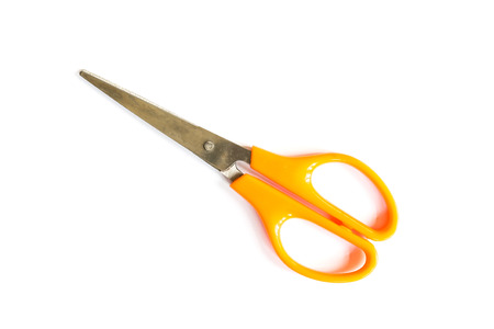close-up of orange scissors isolated on white backgroundの写真素材