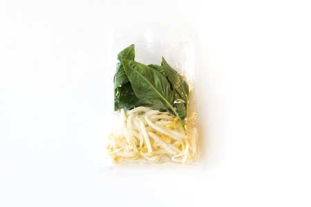 basil leaf and beansprout in plastic food bag for side dished of noodle (thai style)の写真素材