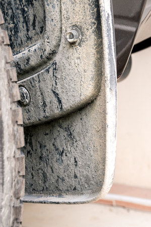 cement powder on mudguard and wheelの写真素材