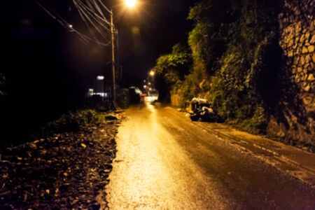 blurred of alley in rainy nightの写真素材
