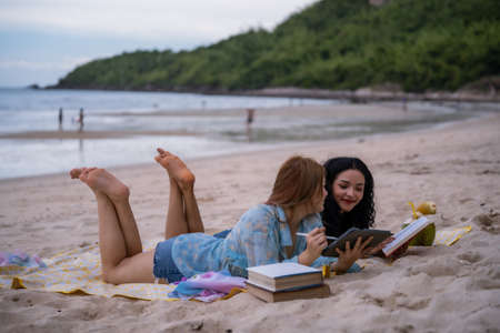Women LGBT Relationship summer holiday on the beach.の写真素材