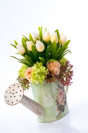 The artificial flowers in a vintage vase の写真素材