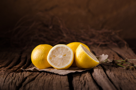 Fresh lemons on wooden background.の写真素材