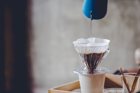 Making brewed coffee from steaming filter drip style.の写真素材