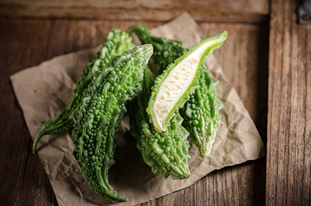 Raw Green Organic Bitter Melon on wooden Table.の写真素材