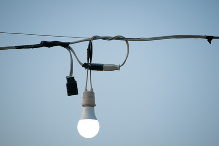 Lamp with wires and sky background.の写真素材