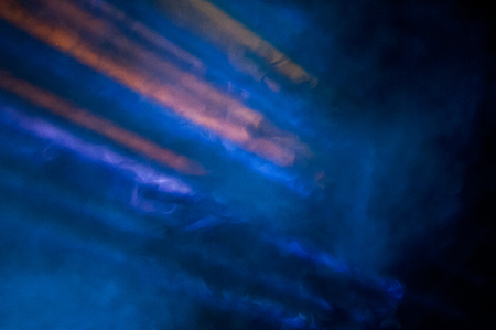 Blur focus lights on bright lights with Laser rays, spotlight and smoke, Abstract background.の写真素材