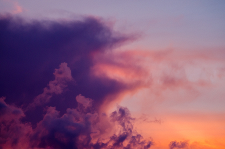 Abstract nature background. Dramatic and moody pink, purple and blue cloudy sunset.の写真素材