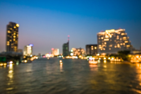 Abstract blurred cityscape with bokeh on twilgiht backgroundの写真素材