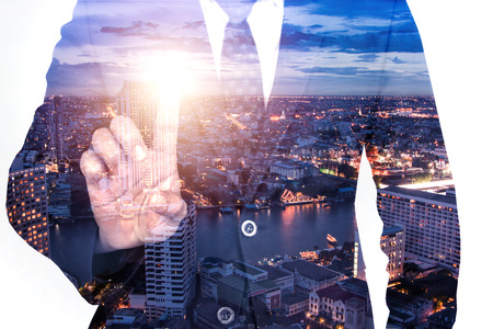 Double exposure globalization real estate business with city backgroundの写真素材