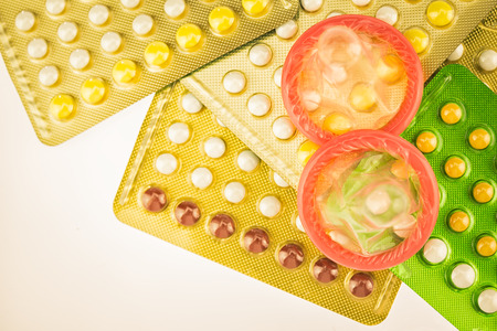 Birth control pill and condomの写真素材