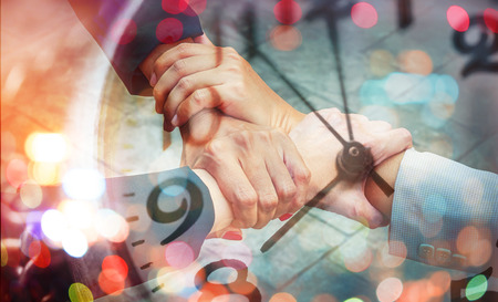 Double Exposure Business group with hands together with retro clock and bokehの写真素材