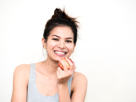 Young woman looking healthy on white backgroundの写真素材