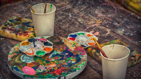 Paint brushes and palette water paints for studentの写真素材