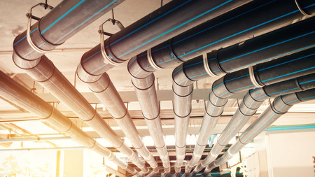 Black manage water pipe, safety and clean watering system in condominium or modern building construction.の写真素材