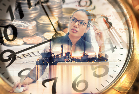 Double exposure clock and  beautiful business woman is thinking marketing planの写真素材
