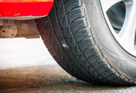 Screw punctured car tireの写真素材