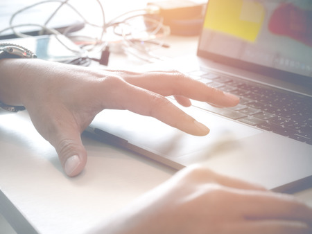 Businessman typing laptop in vintage tone style backgroundの写真素材
