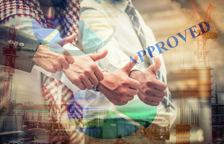Double Exposure Hand of teamwork pose finger thumb up (like) with graph ,Business conceptの写真素材